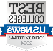 Logo of U.S. News & World Report featuring the text 'BEST COLLEGES', 'USN&WR', and 'Psychology Programs 2024' on a badge with a gray and white color scheme and blue and red ribbons.